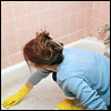 maid cleaning bathtub